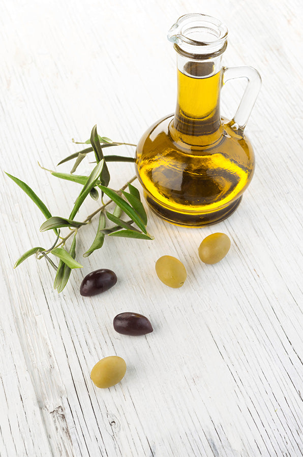Fresh harvest olio nuovo olive oil bottle on timber table — Kyneton Olive Oil
